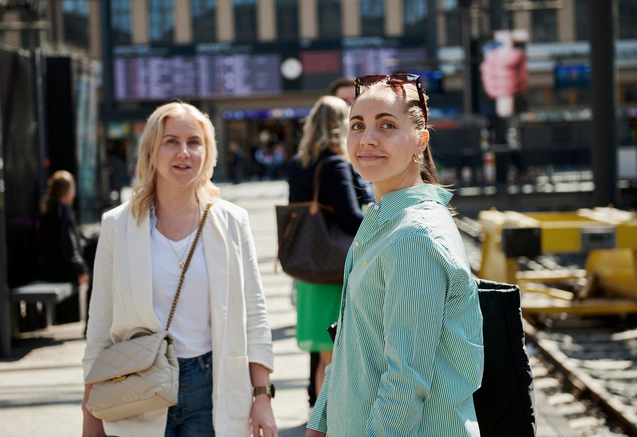 Women standing on train platform