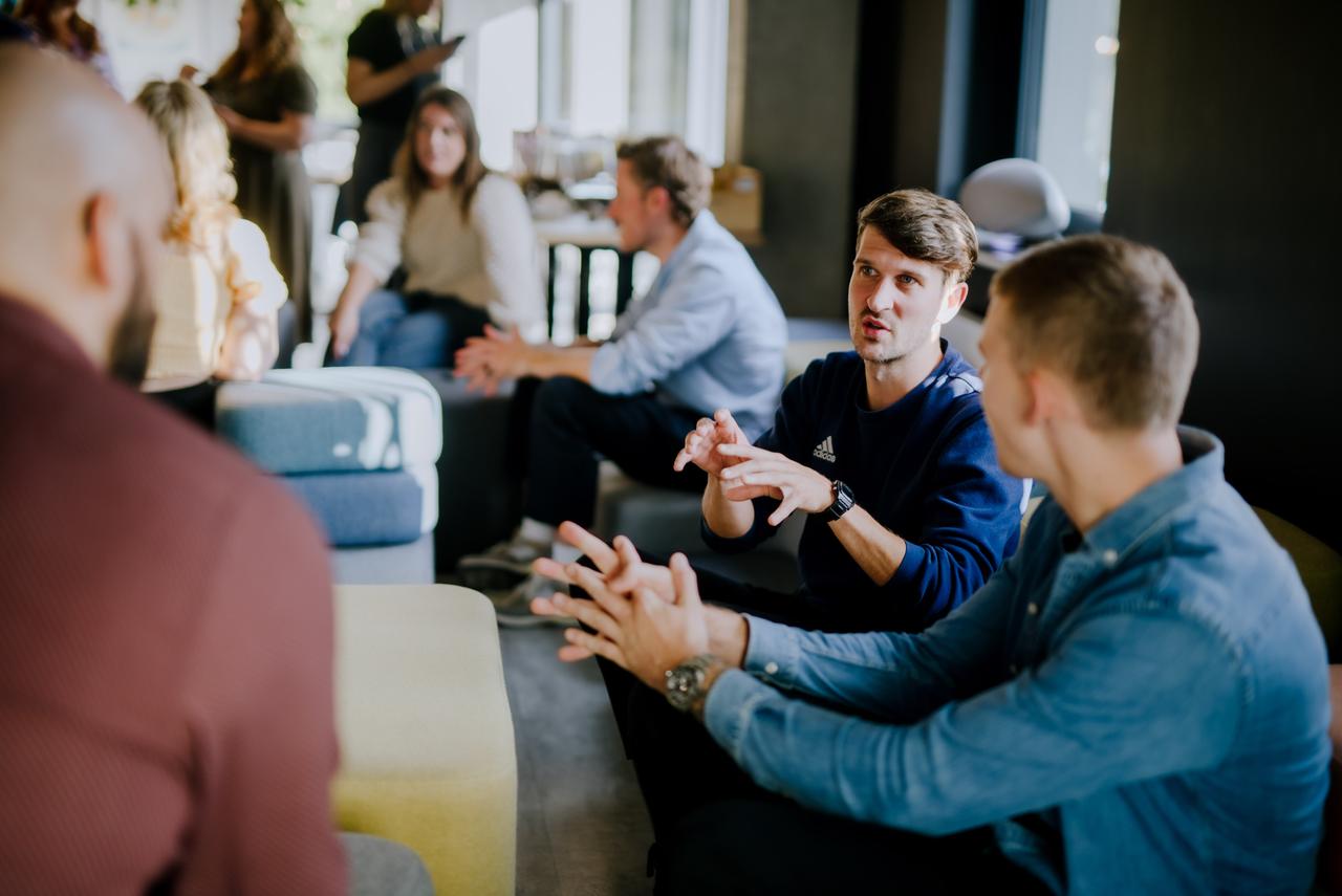 Group of colleagues talking at work