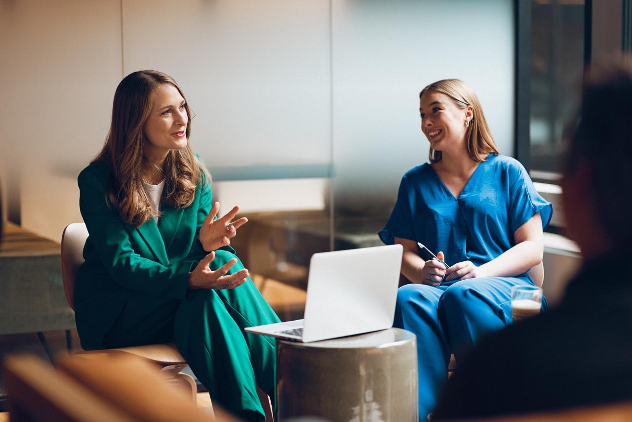 women talking in an office