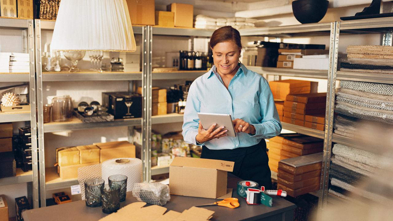 Woman in warehouse doing inventory