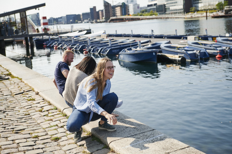 People sitting by the water