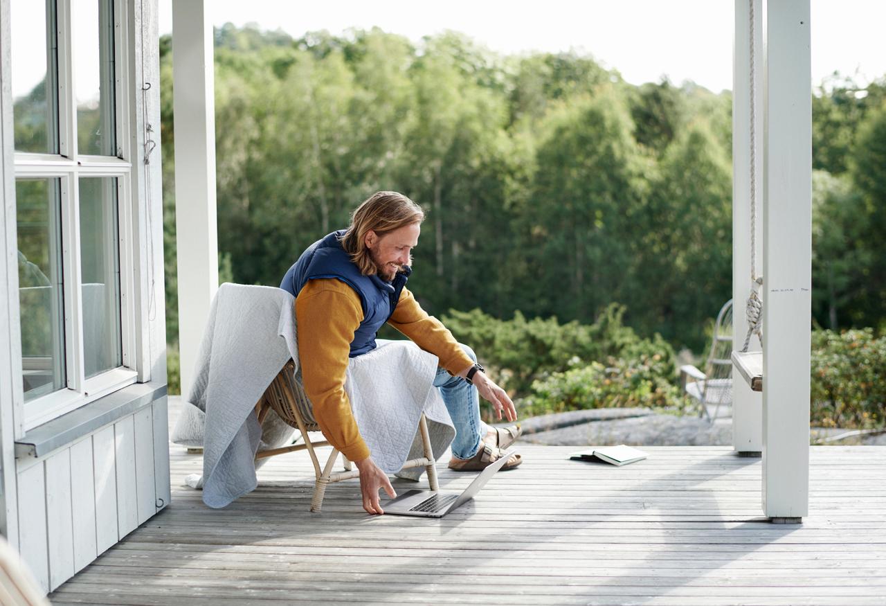 Man sitting outside with laptop