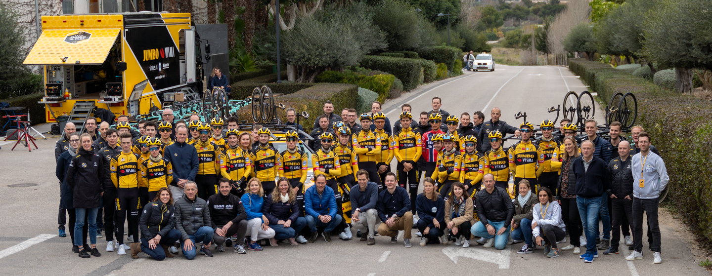 A group photo from location with Team Jumbo-Visma riders, staff, sponsors and media teams