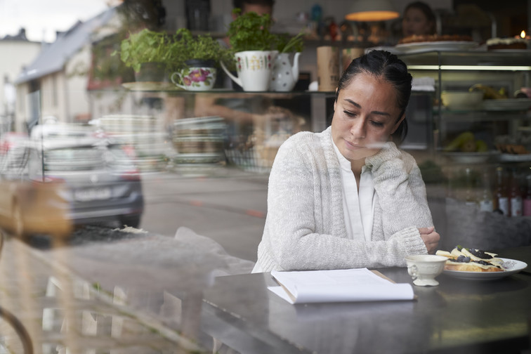 Woman looking at a paper report