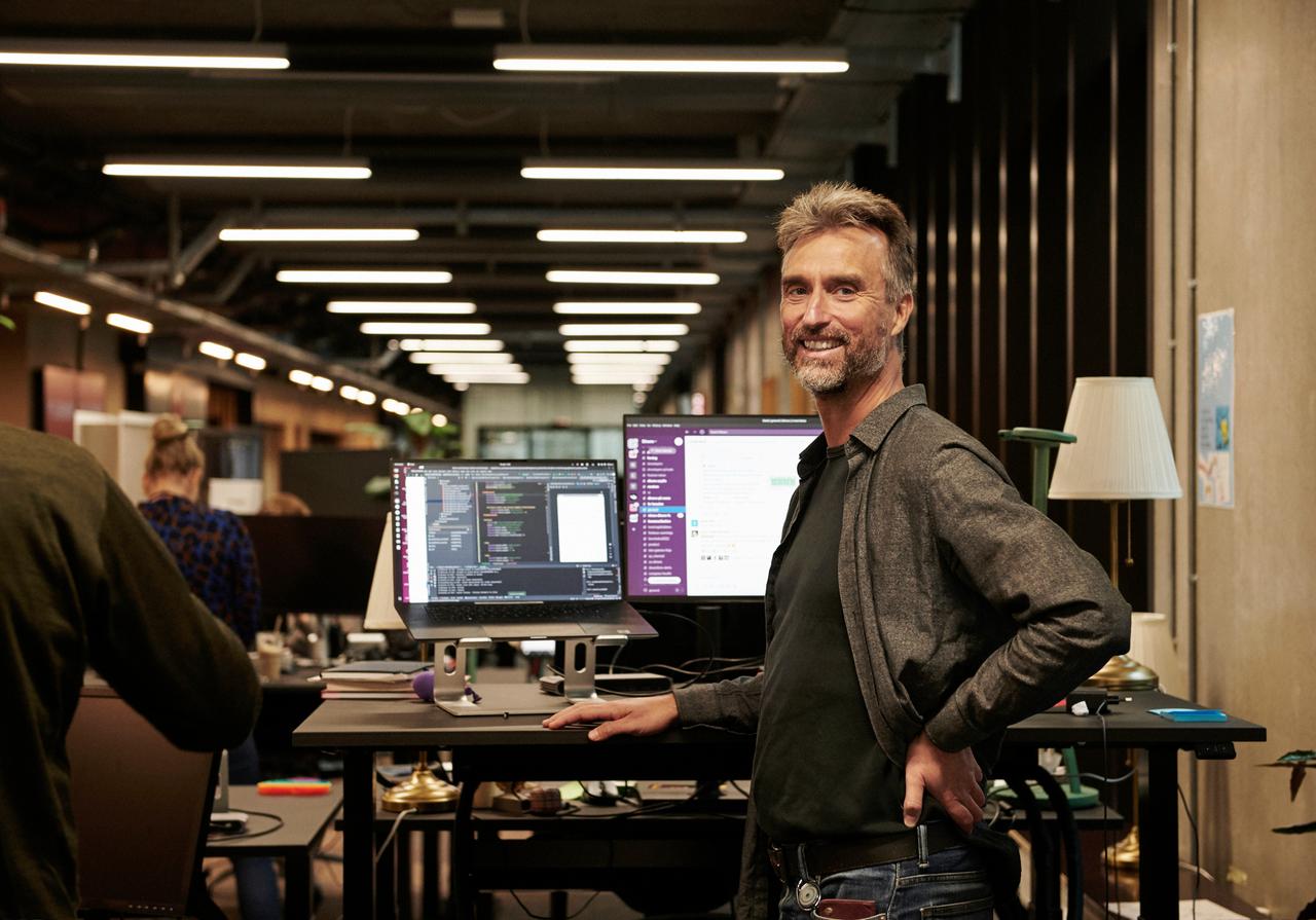 man standing at desk