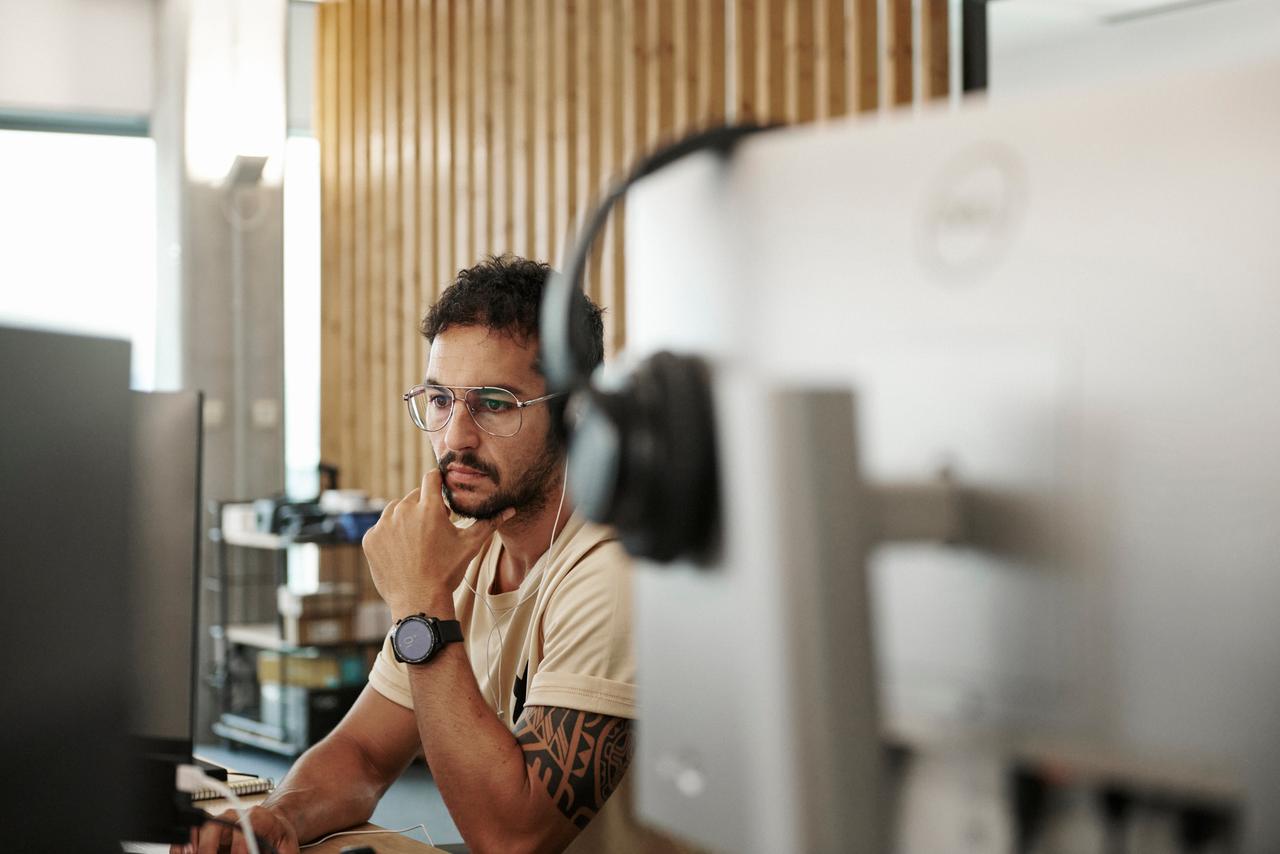 Programmer sitting at computer