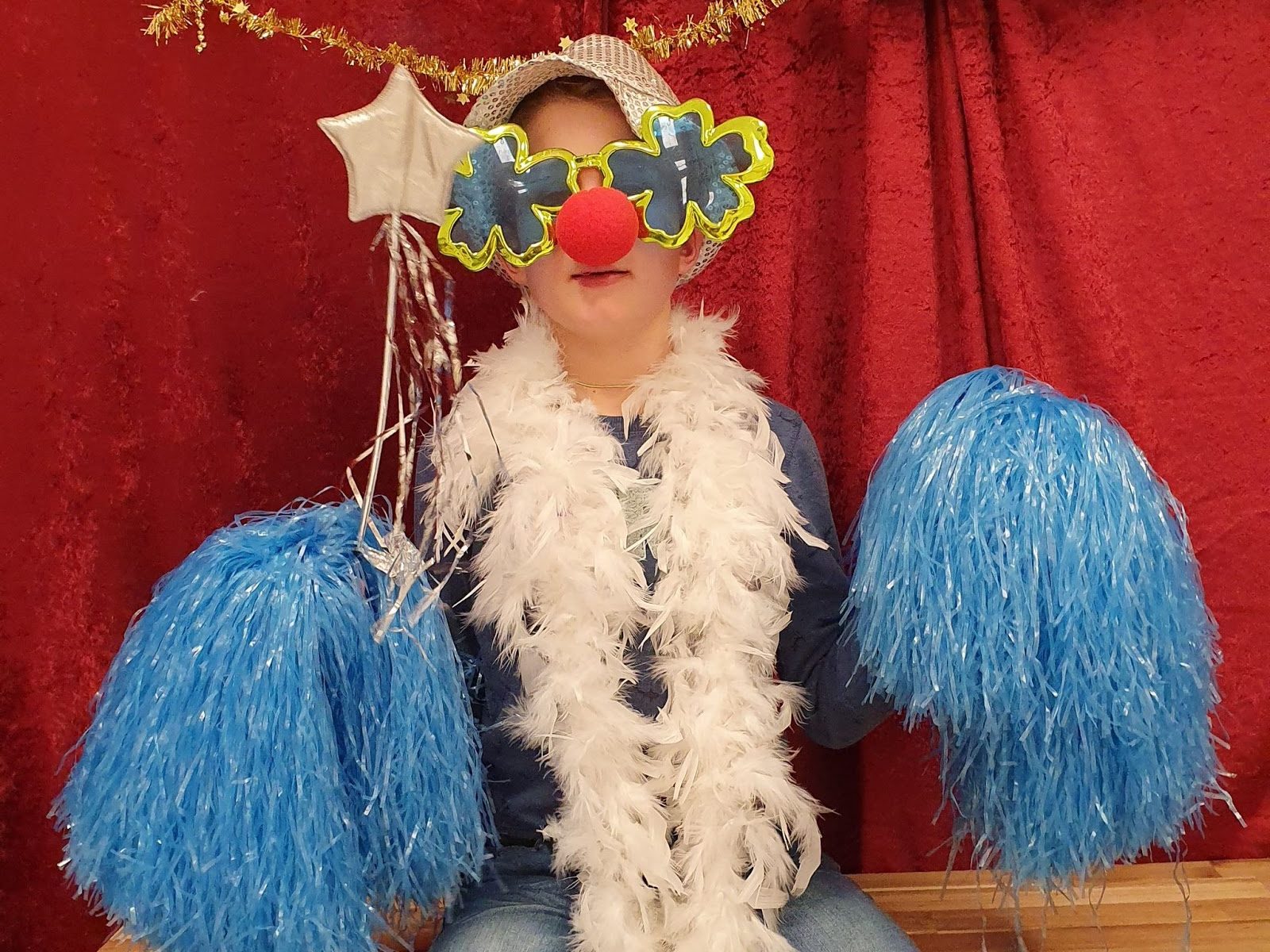 A child dressed up for a photo during the winter wonderland party that Visma Raet initiated for students, teachers, and parents at a school for children with Down syndrome